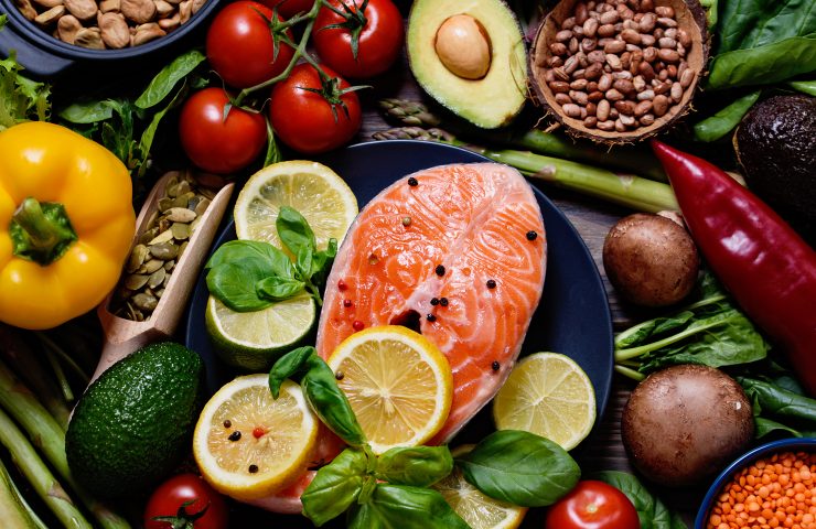 Healthy food for ketogenic diet concept on black background. Foods high in vitamins, minerals and antioxidants.