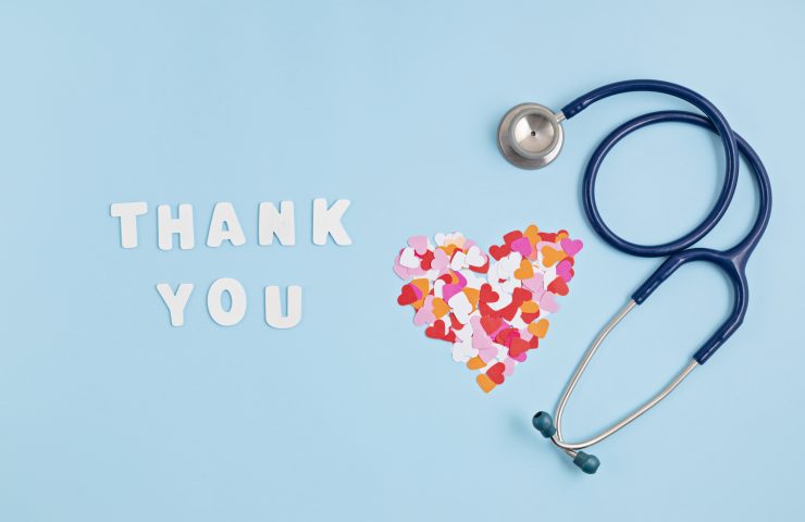 Hearts confetti and text thank you. Expressing gratitude to doctors and nurses