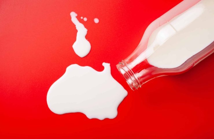 bad milk lactose intolerance allergy. milk bottle splatter. avoi
