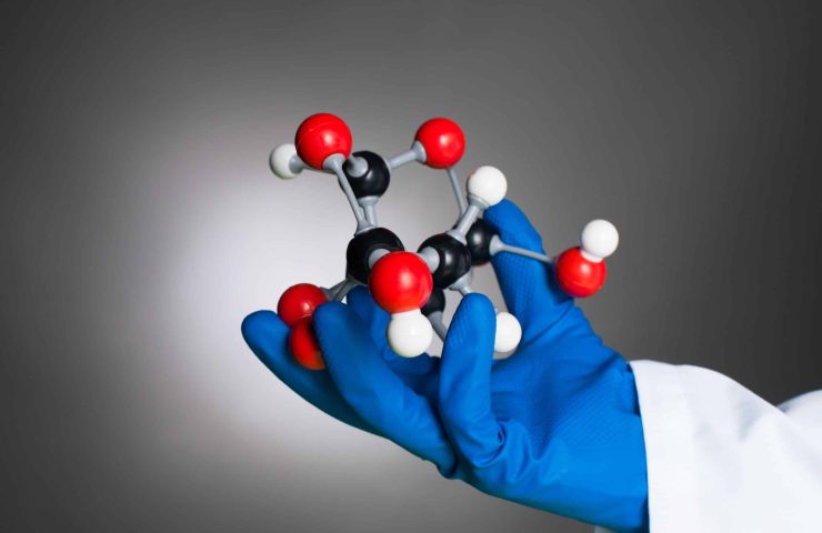 hand holding a mollecular structure model