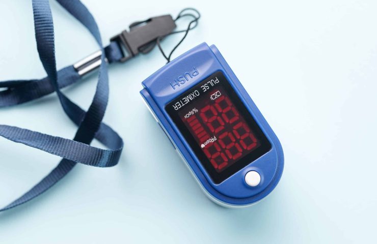 Pulse oximeter on blue background