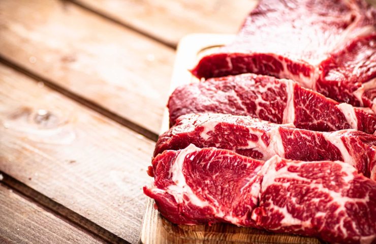 Chopped raw beef on a cutting board.