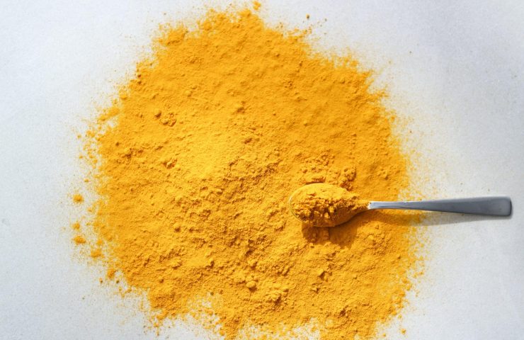 close-up-shot-of-turmeric-curcuma-in-the-spoon-2022-11-09-18-54-21-utc