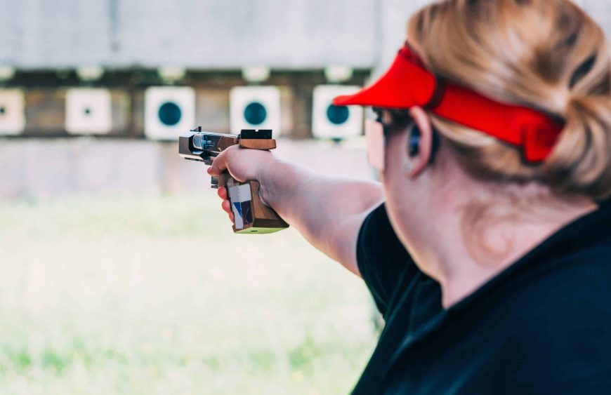 Woman on sport shooting training shooting target